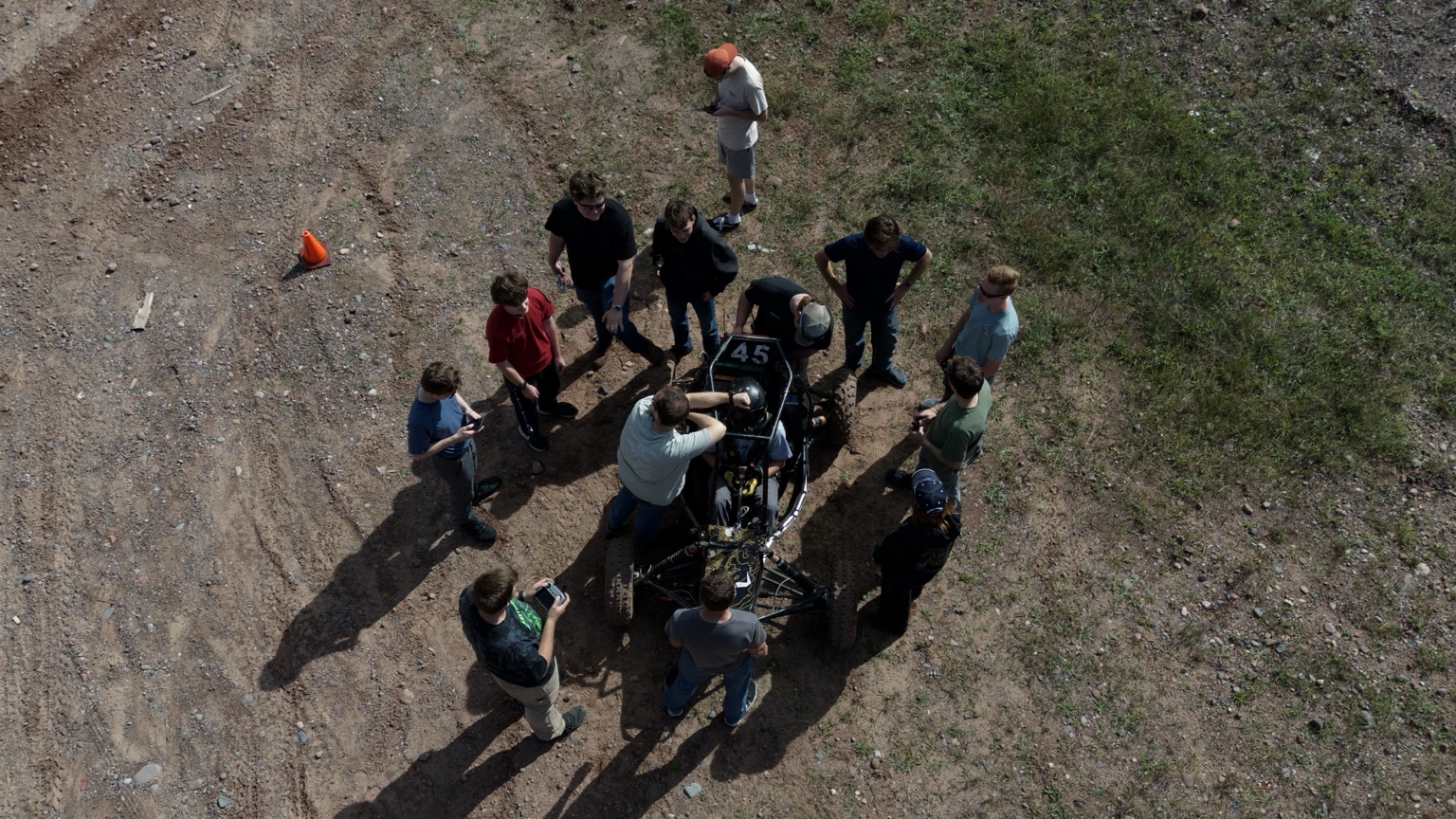 Blizzard Baja members working around the competition vehicle