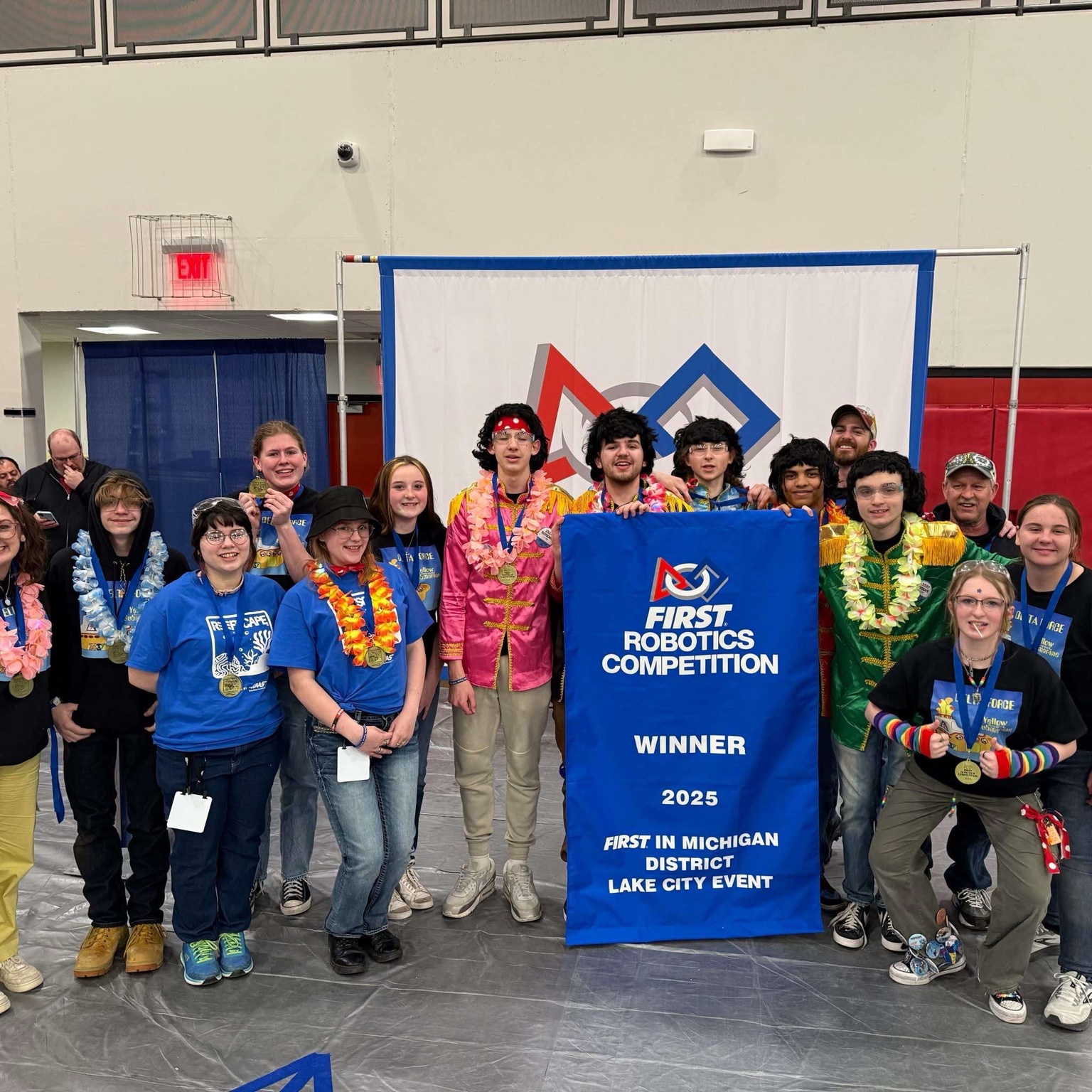 FIRST Robotics team with the 2025 Lake City Event winner banner